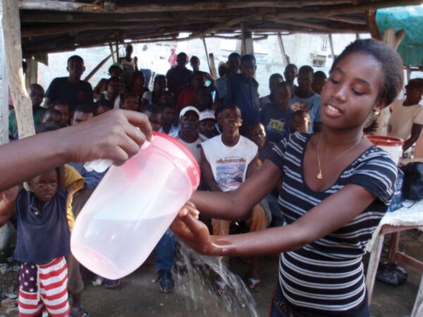 Community outreach: A neighborhood hand washing demonstration in 2010.
