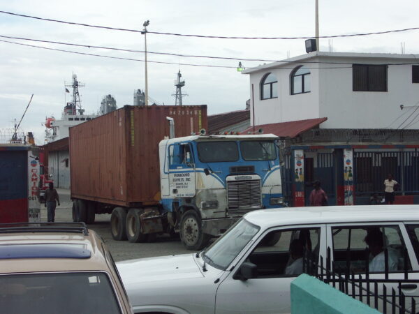 An early container from Konbit Sante moves out of the port of Cap-Haitien.